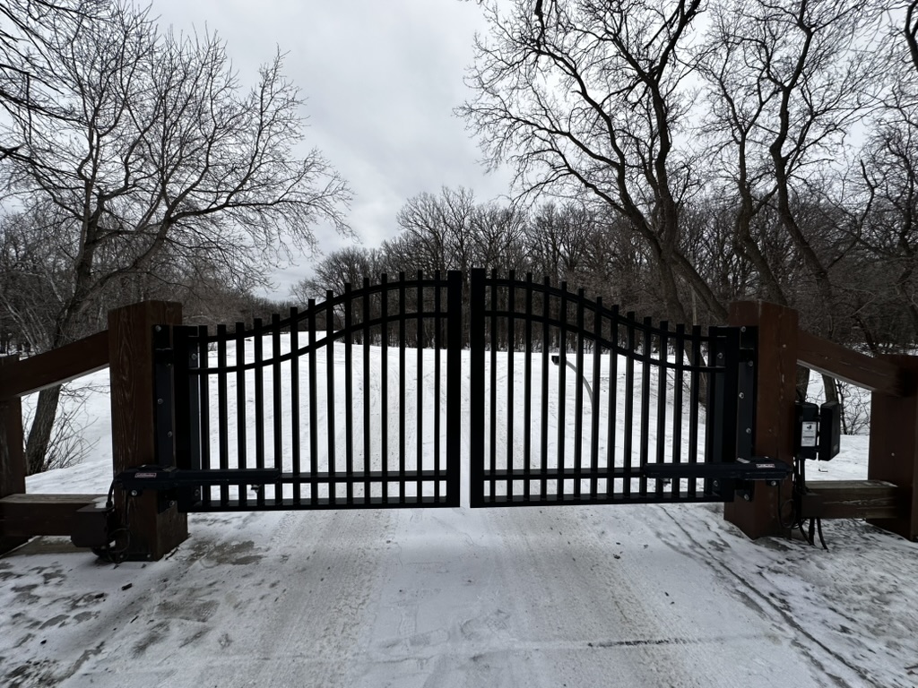 Ornamental iron fence in winter setting
