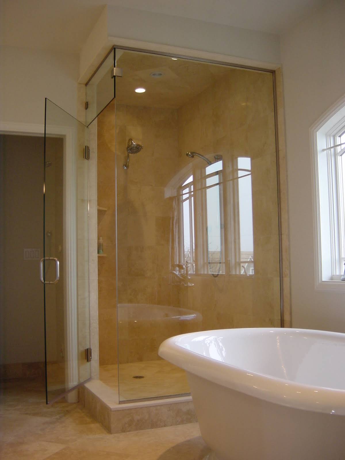 Frameless shower enclosure installed by Alder Glass & Aluminum