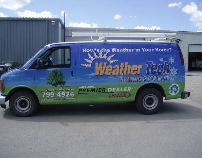Weather Tech Heating & Cooling wrapped service van with roof ladder rack parked at the shop