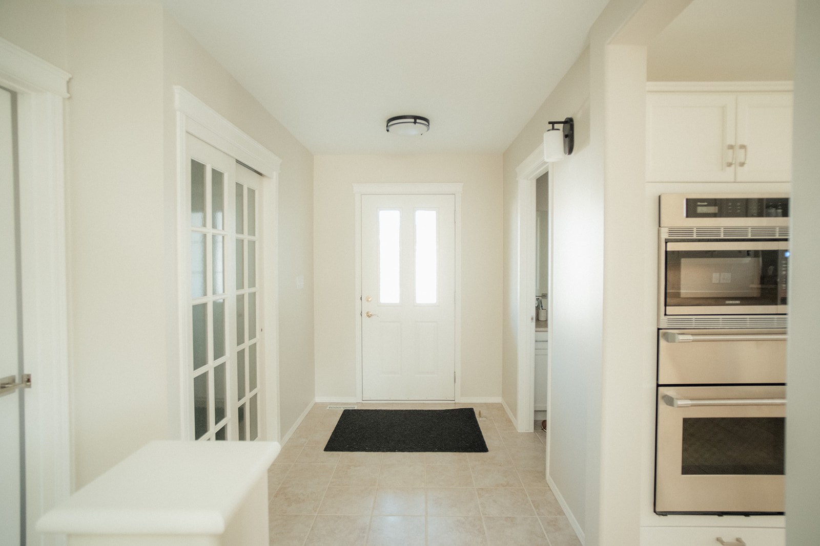 Interior entryway freshly painted with off-white walls and clean trim