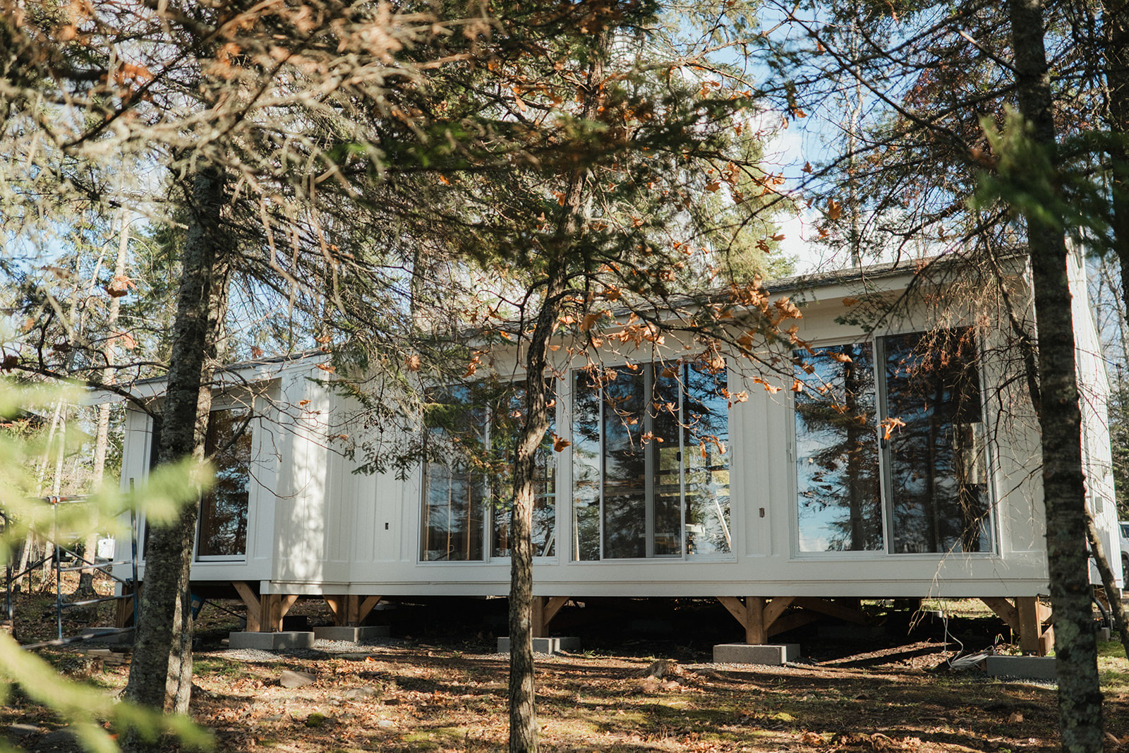 Freshly painted white exterior of a residential cabin by Integrity Painting in Winnipeg