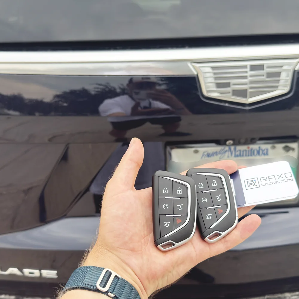 Two Cadillac Escalade smart key fobs cut and programmed on-site in Winnipeg